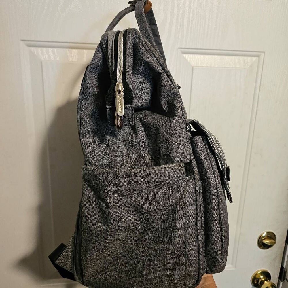 Lekebaby diaper bag backpack in a gray and white arrow print.